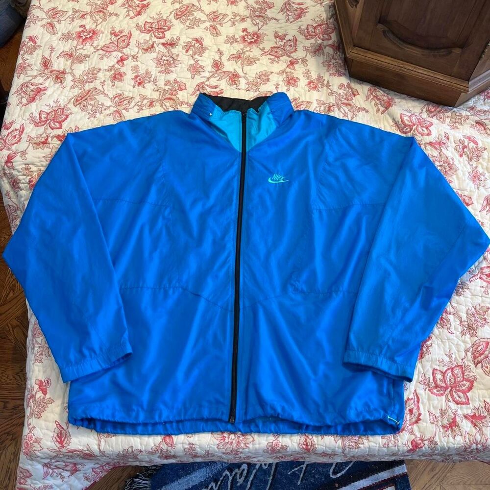 Vintage 1990s Nike Turquoise Blue embroidered swoosh full zip windbreaker jacket